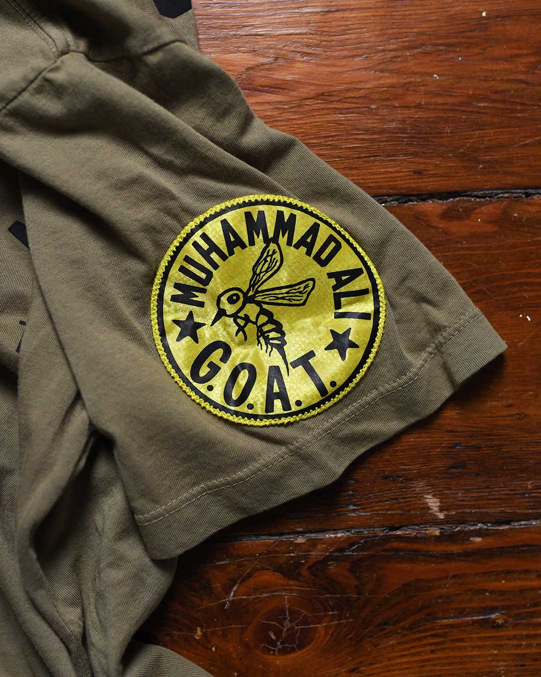 Ali Deer Lake Float Quote Olive Tee - Roots of Fight